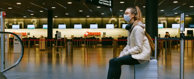 woman in airport with mask