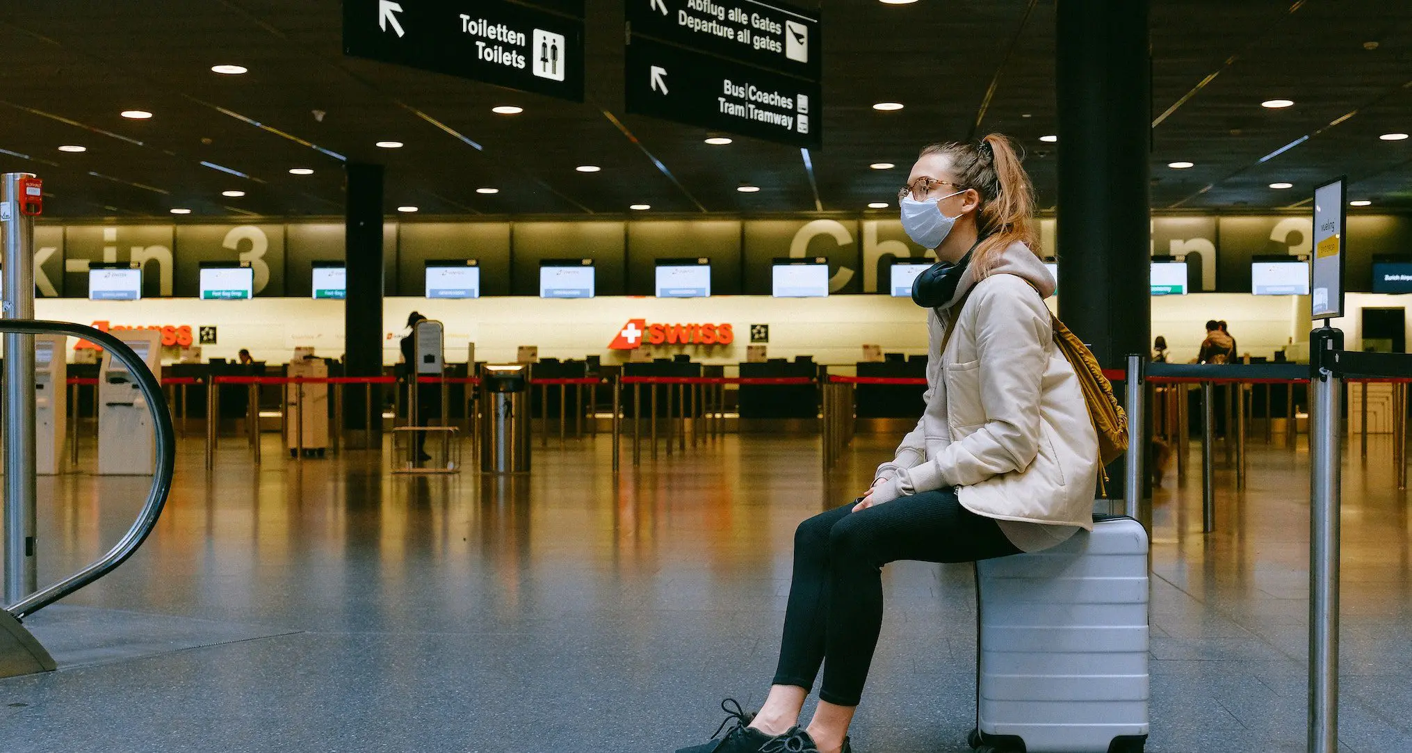woman in airport with mask