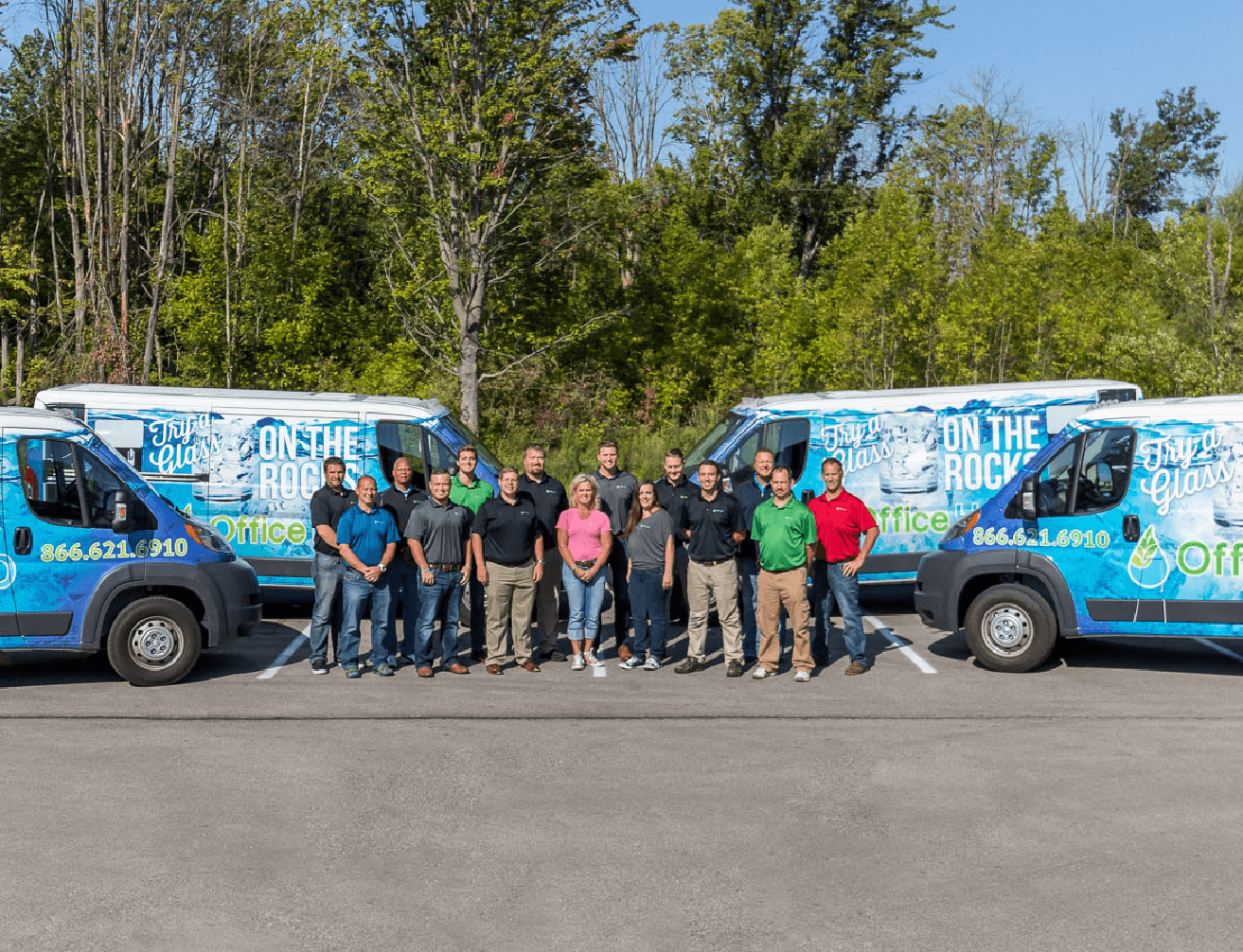 Office H2O Staff infront of service vans Office H2O Staff infront of service vans