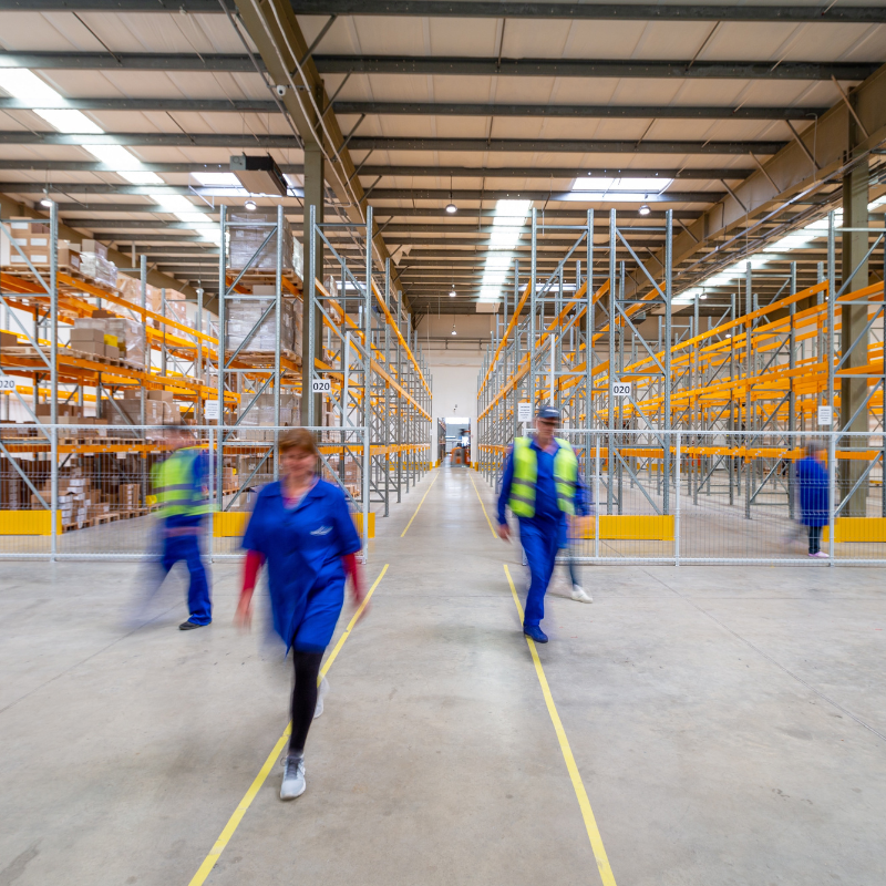 warehouse workers on the move in a warehouse