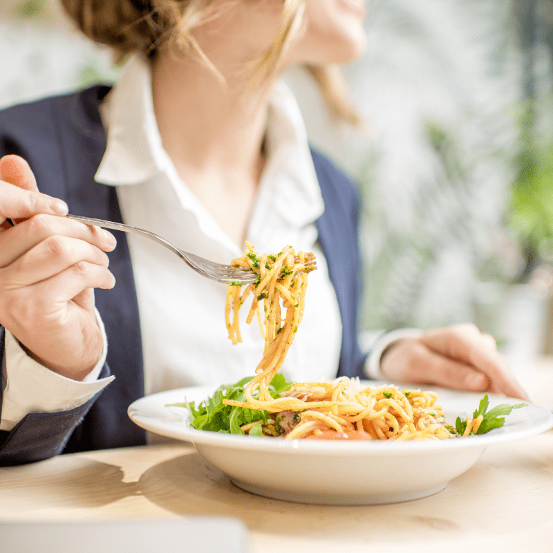 business woman eating at work