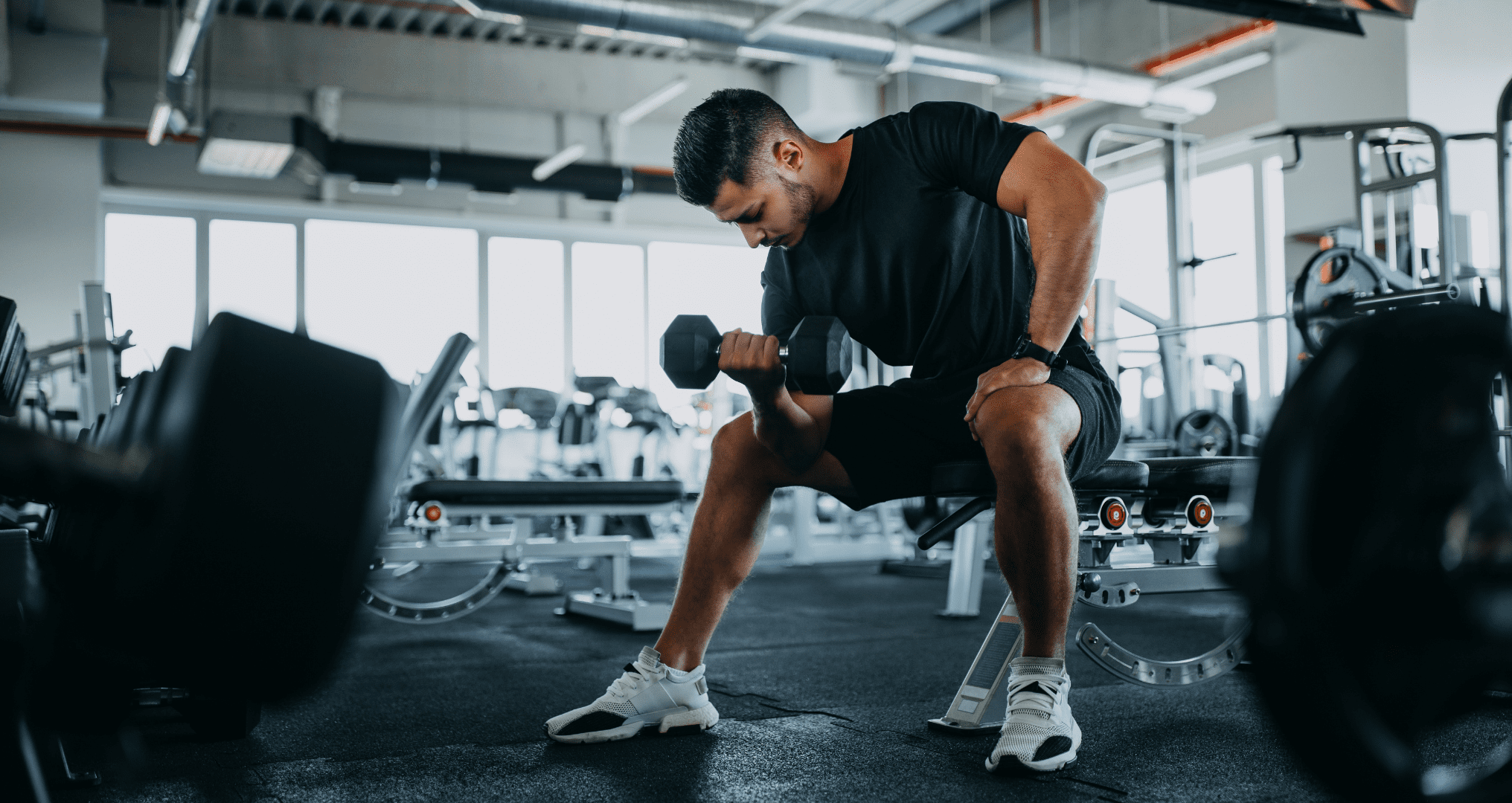 man working out in the gym to lose weight