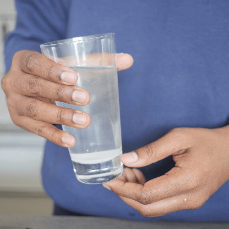 dirty water from the tap in a glass