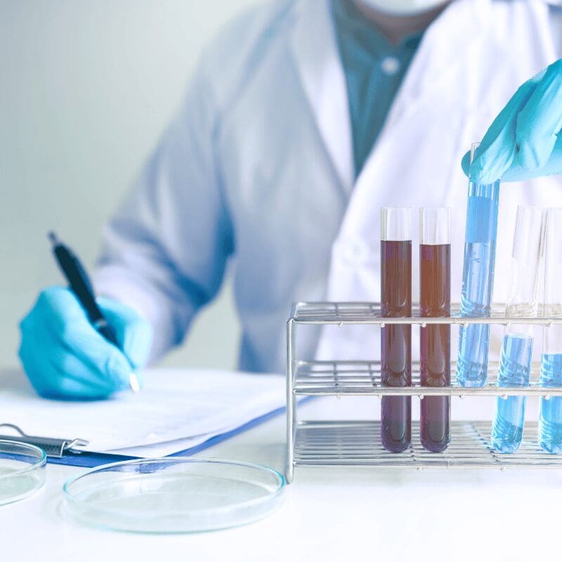 male scientist running a water test for PFAS