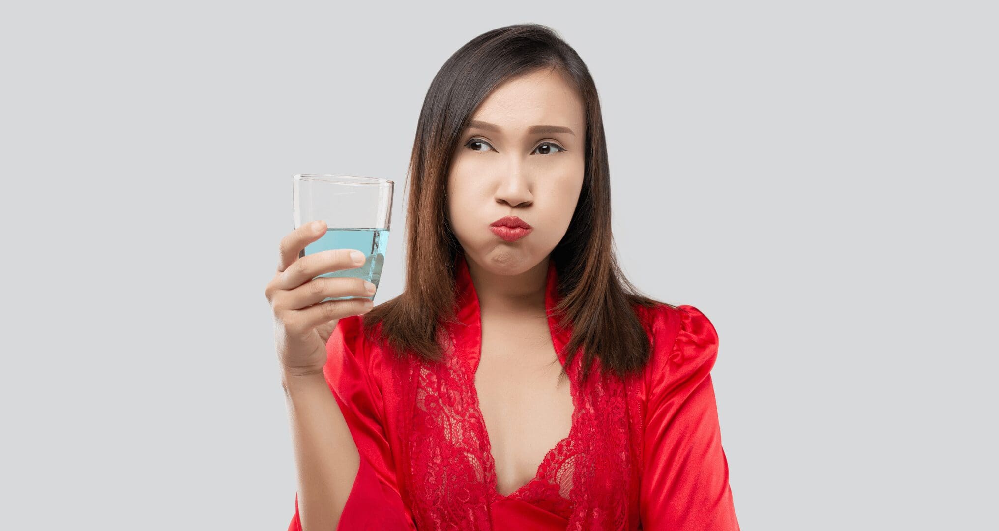 woman gargling fluoride treatment