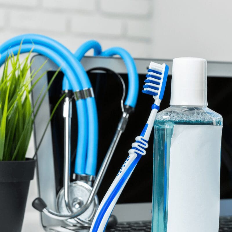 toothbrushes-on-the-table-on-light-background (1) toothbrushes on the table