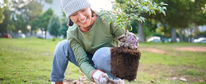 volunteer woman planting a tree