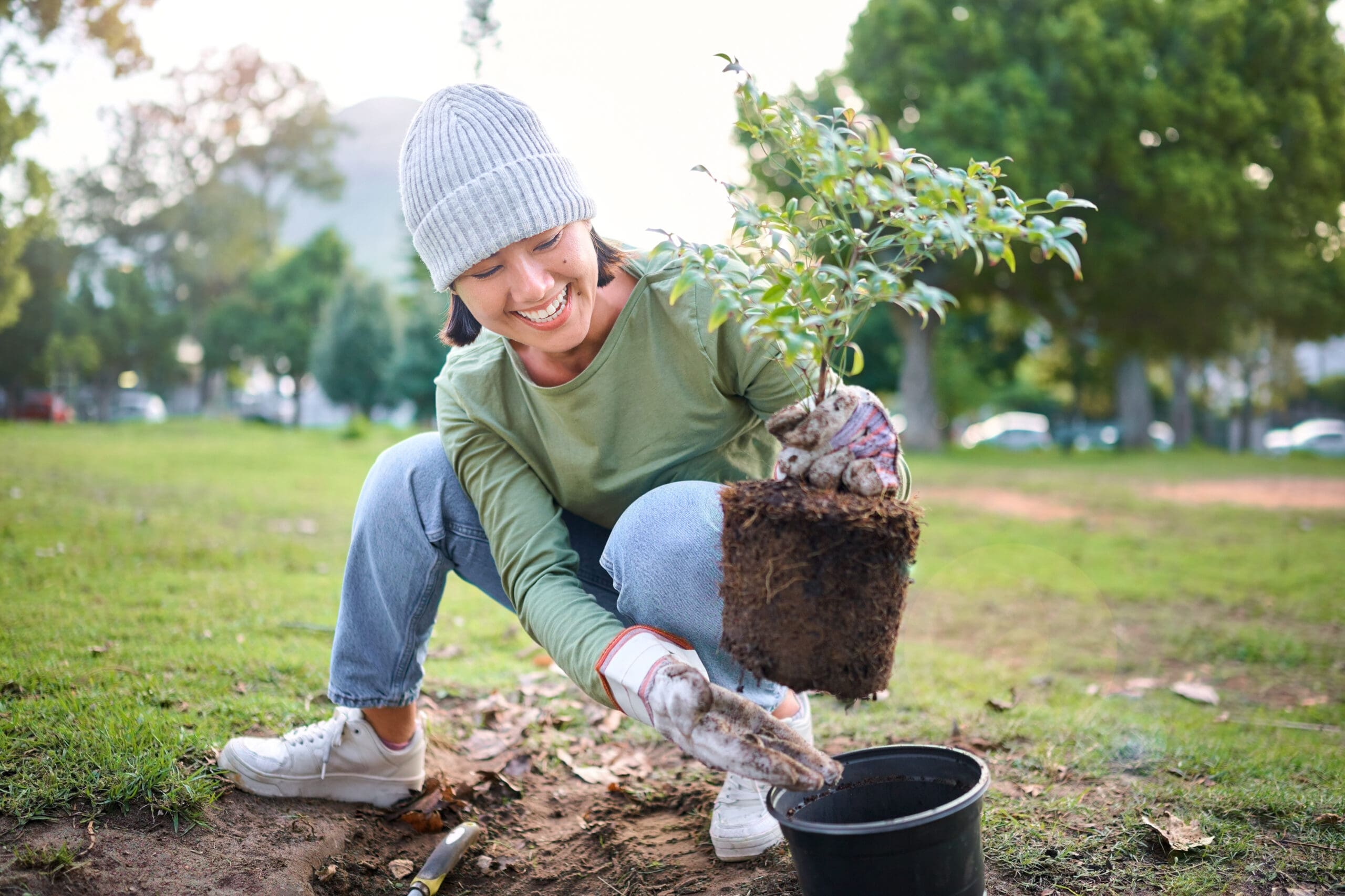 volunteer woman planting a tree