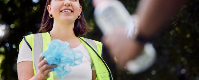 two volunteers cleaning up local community