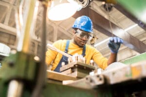 Indiana factory worker at his machine