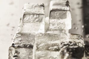 close up view of transparent wet textured ice cubes close up view of transparent wet textured ice cubes
