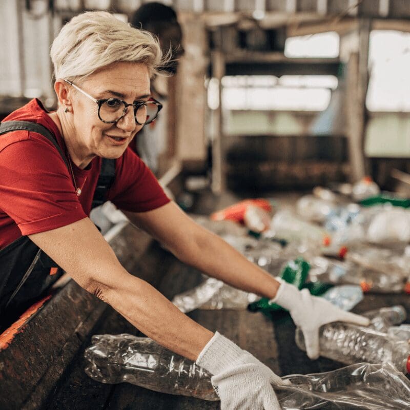 woman at recycling facility (1) woman working in recycling facility