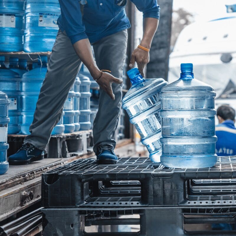 5-gallon water jugs being delivered