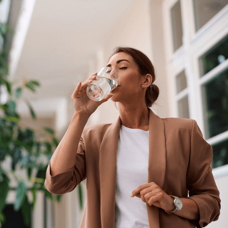 female business woman enjoying a glass of water